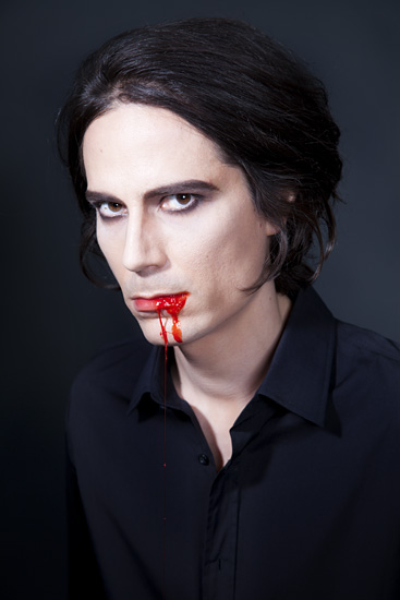 portrait of demon or vampire with blood on his lips